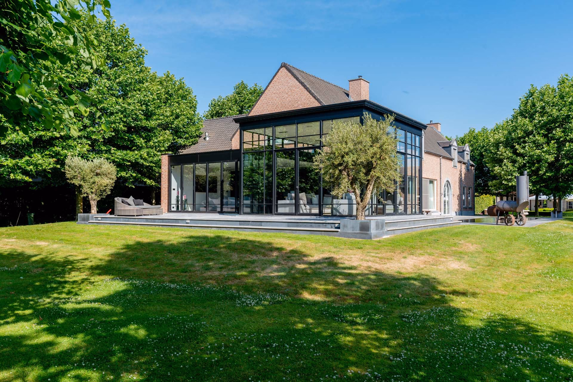 Aluminium vouwwand met steellook ramen in Dendermonde